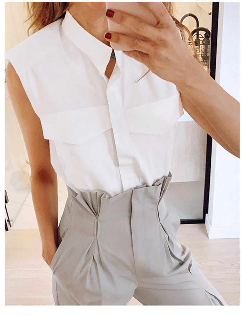 Elegant white sleeveless collared shirt with front pockets, perfect for fall fashion
