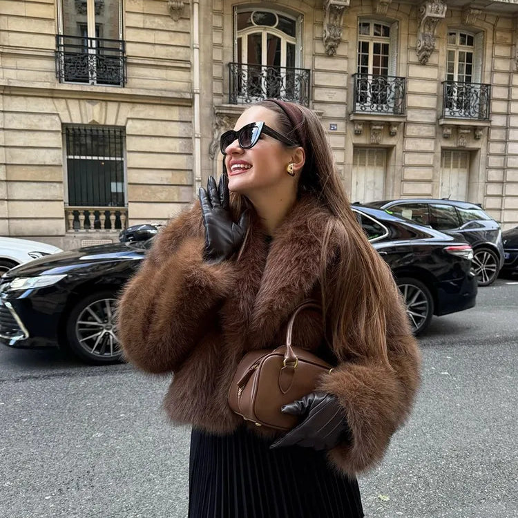 Gorgeous faux fur Langry fox jacket with black pleated skirt and sunglasses