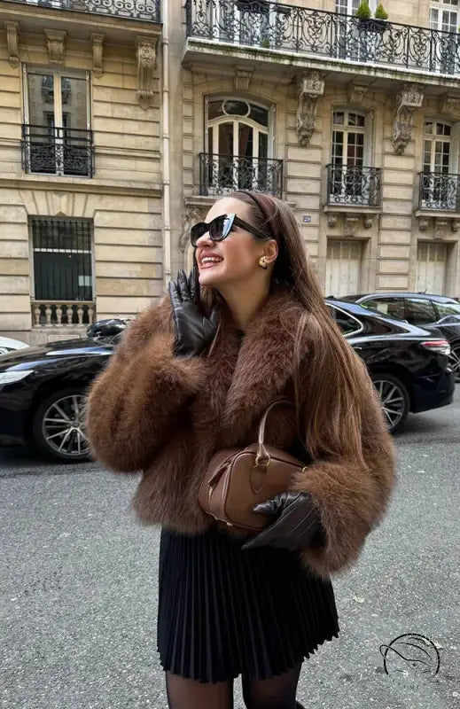 Gorgeous langry faux fur fox jacket with black pleated skirt and sunglasses