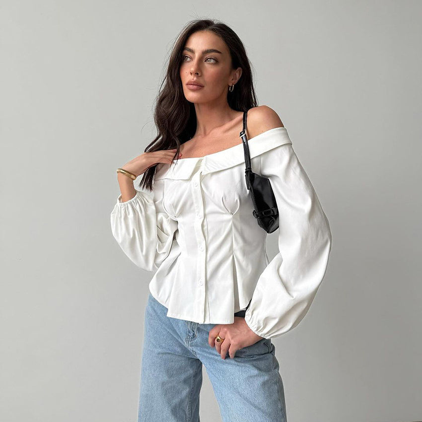 Elegant French off-shoulder shirt styled with billowy sleeves and light blue jeans for fashion