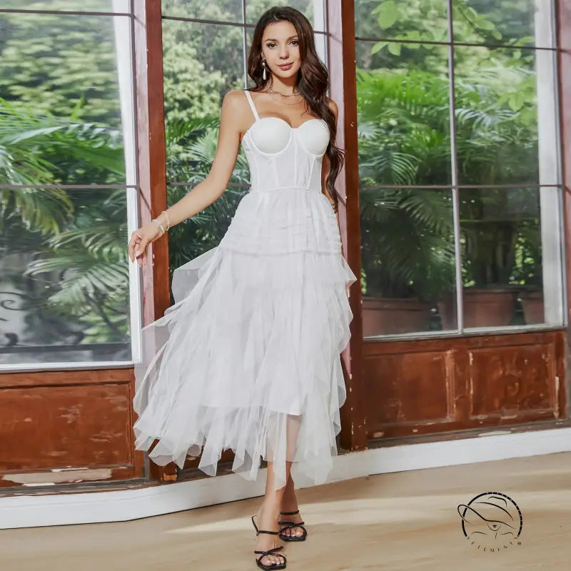 White tiered tulle french tube dress with yarn straps and large swing