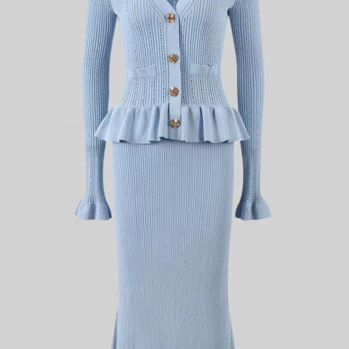 Elegant light blue knit dress and skirt set showcasing timeless fashion style