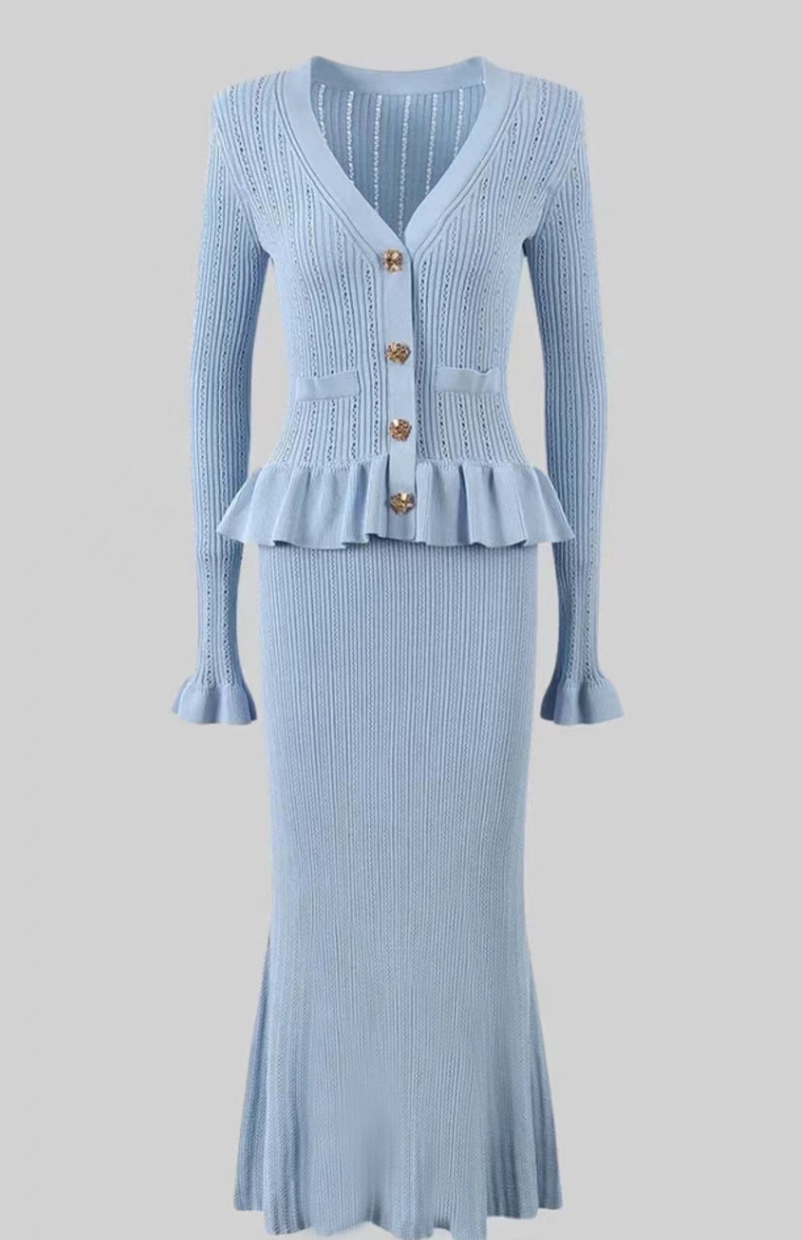 Elegant light blue knit dress and skirt set showcasing timeless fashion style