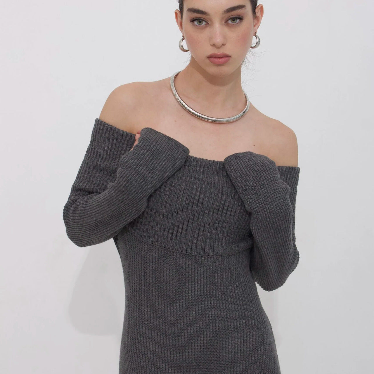Elegant gray off-the-shoulder ribbed knit dress showcasing modern langry fashion style and ملابس
