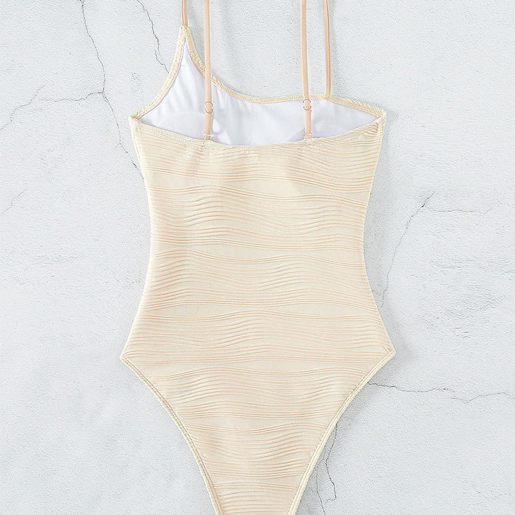 Beige one-piece swimsuit in solid color with push-up design for women