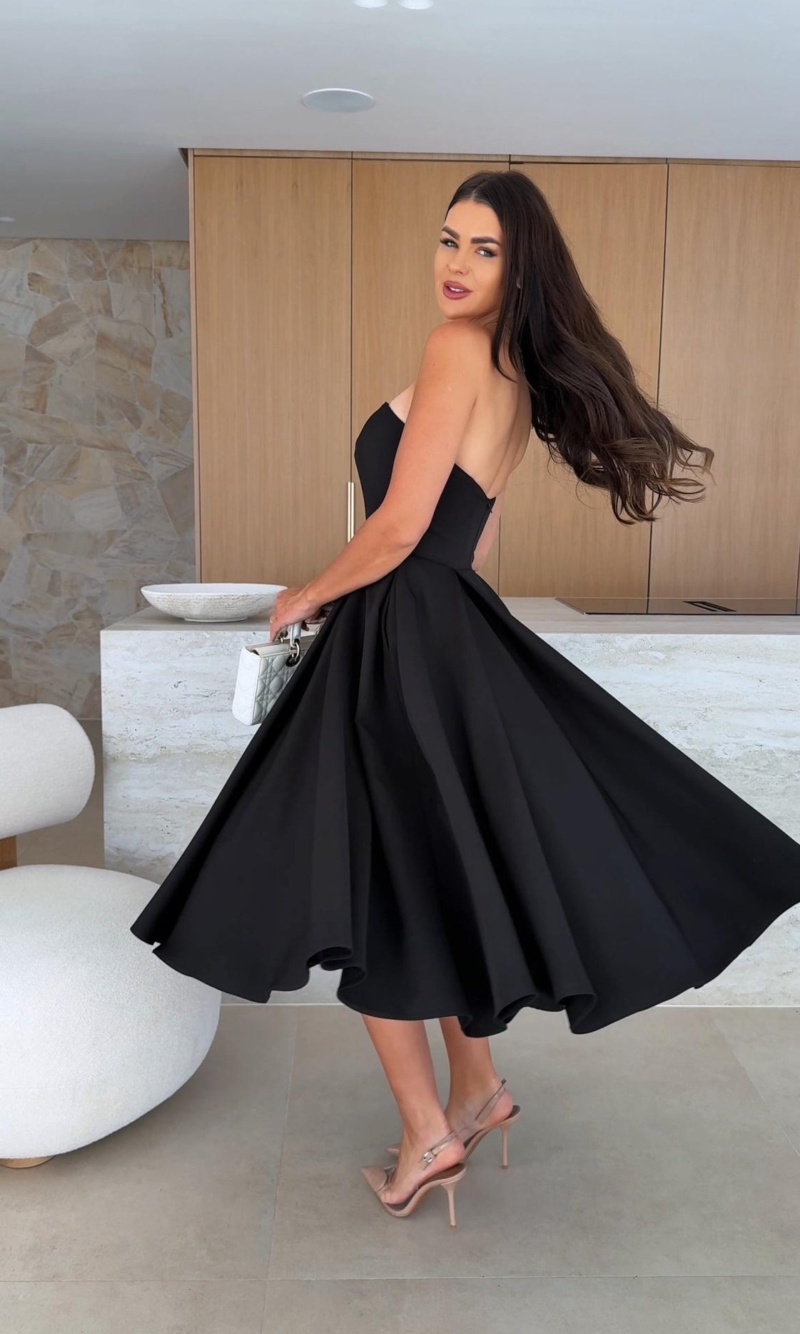 Elegant black strapless dress from Gorgeous Midi Dress, perfect for fashion enthusiasts