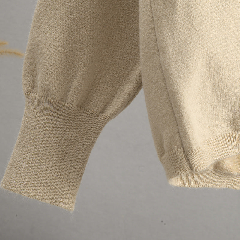 Beige knit sweater with puff sleeves and ribbed cuffs in Langry fashion style