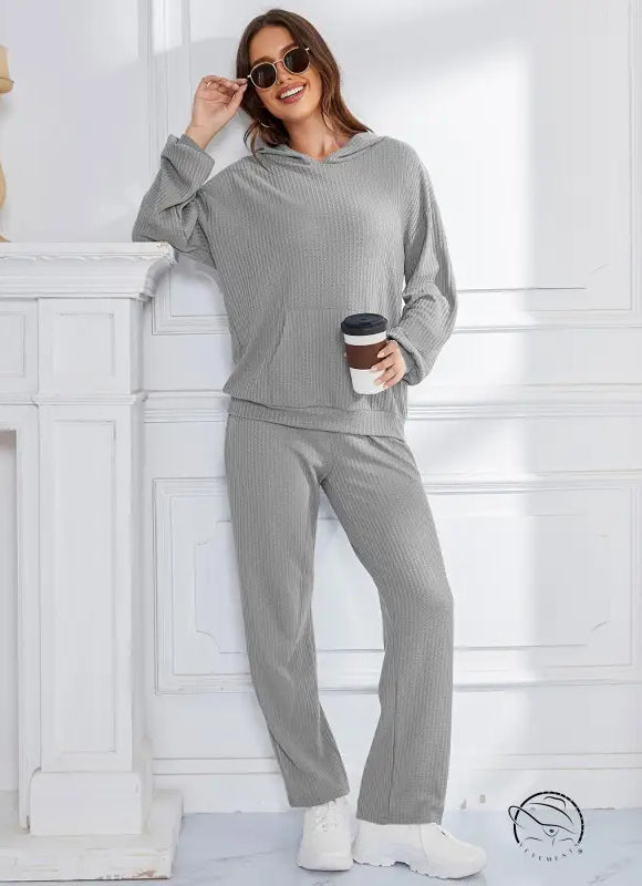 Woman in gray ribbed hooded casual suit lounge set