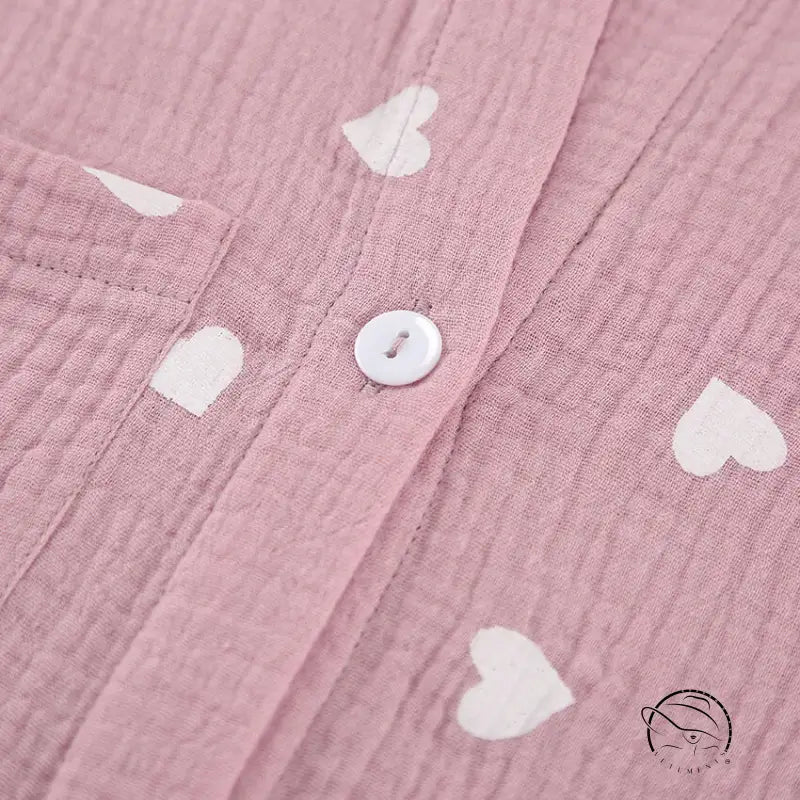 Pink crinkle cotton pajamas set with white heart patterns and button