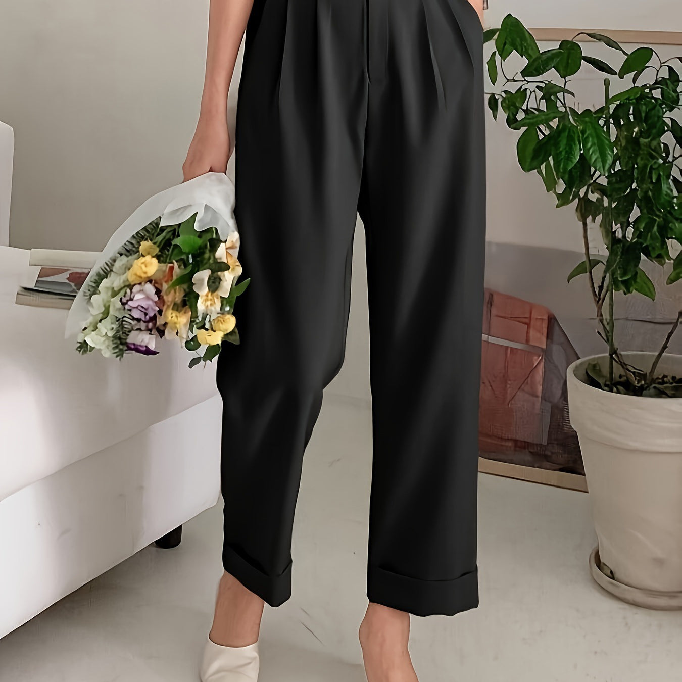 High-waisted black pleated trousers with cream pointed flats, perfect wide leg pant style