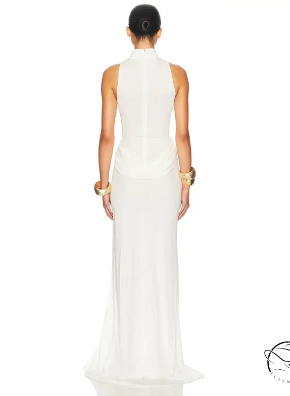 White sleeveless column gown with tight waist, high split, gold accents, high neckline