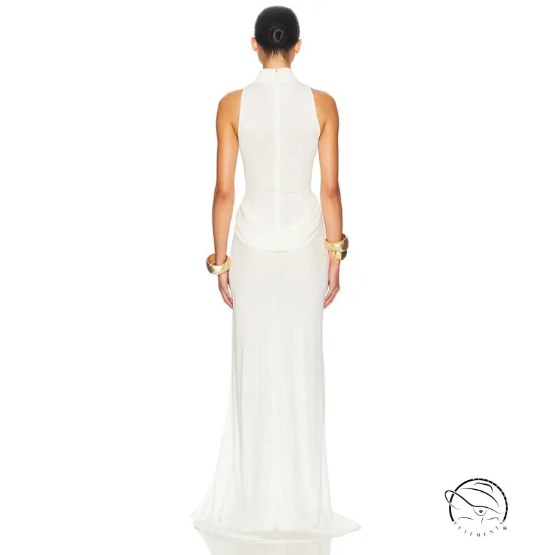 White sleeveless column gown with tight waist, high split, gold accents, high neckline