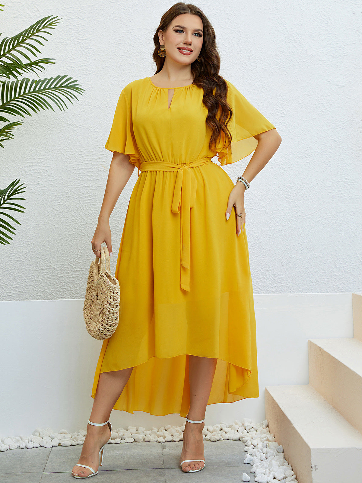 Woman in a yellow high-low dress showcasing elegant lace with free shipping at Langry