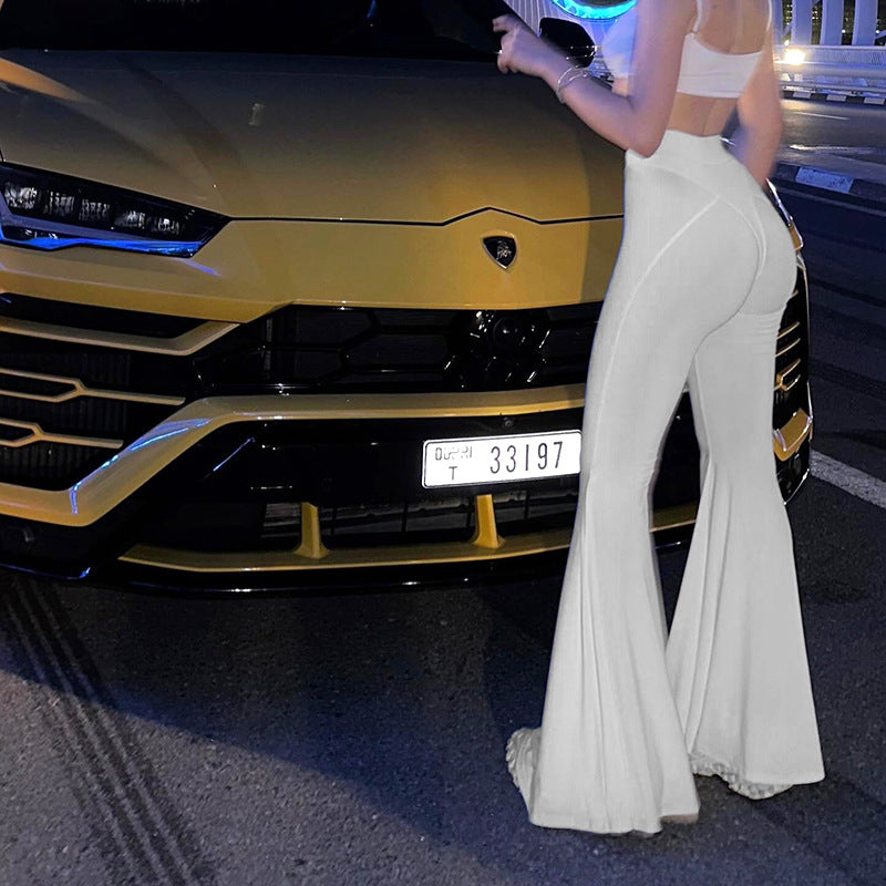 Yellow Lamborghini Urus showcased in fashionable women’s summer see-through high waist slacks