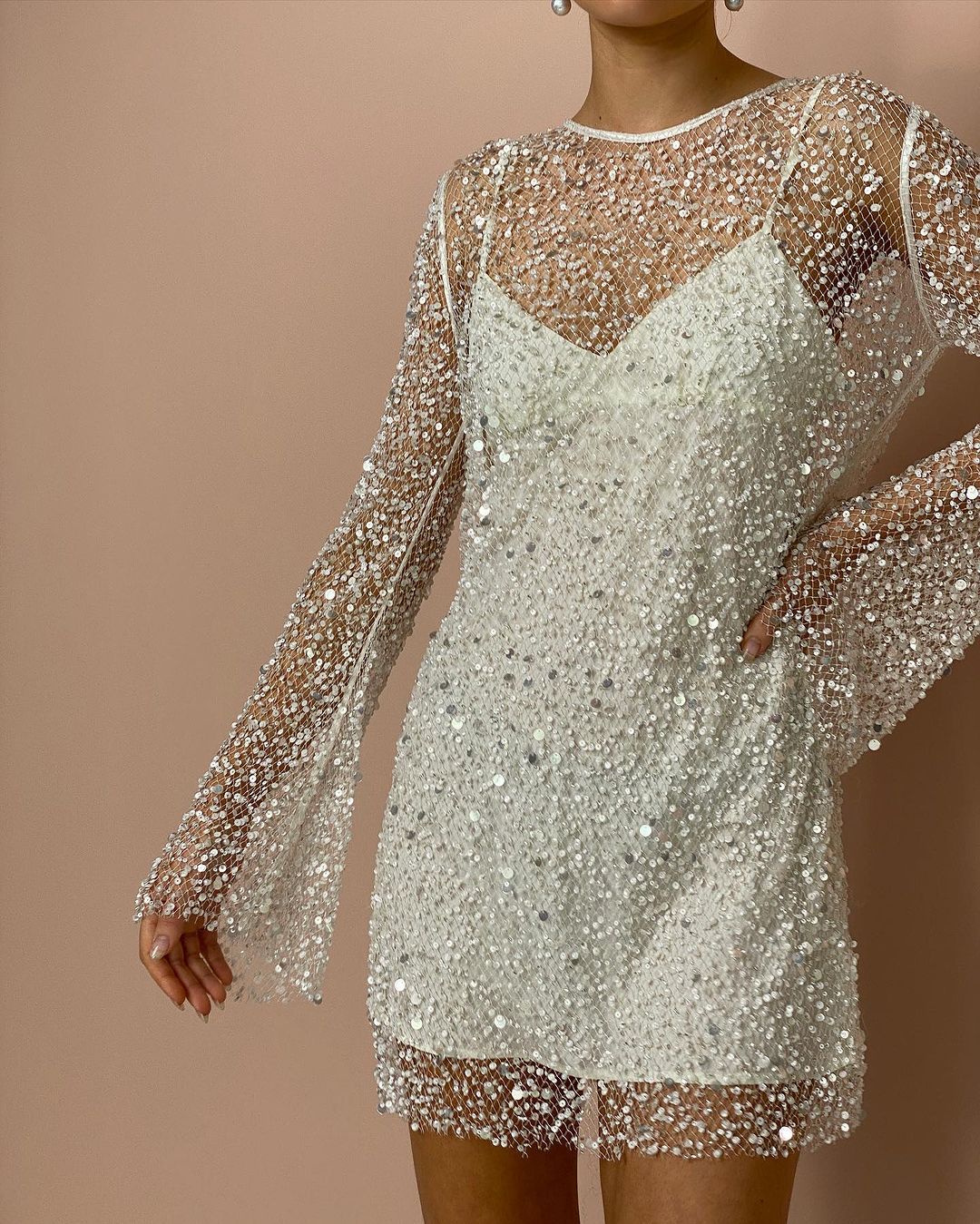 Sequin-covered mini dress with sheer sleeves from Breathtaking Party Dress collection for fashionable ملابس
