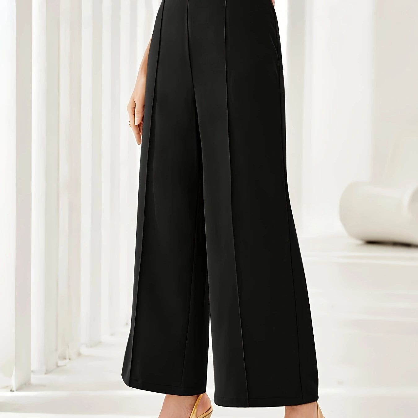 Black wide leg cropped dress pants styled with nude strappy heels for elegant fashion