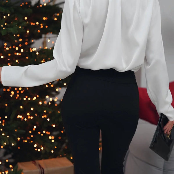 Elegant floral decoration shirt top featuring a white long-sleeved blouse with shoulder pads