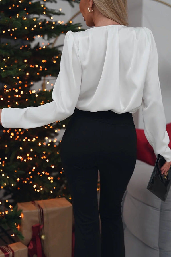 Elegant floral decoration shirt top featuring a white long-sleeved blouse with shoulder pads