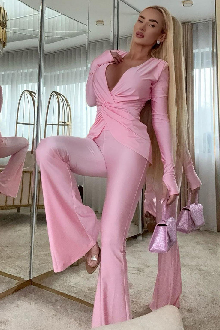 Pink satin long sleeve jumpsuit with ruffled details and high slit