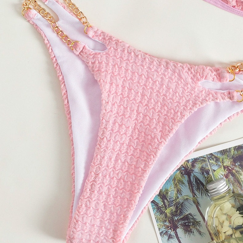 Pink textured bikini bottom with gold chain detail from the Backless Split Swimsuit collection