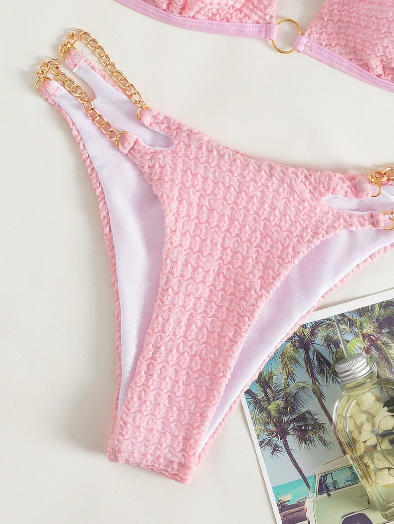 Pink textured bikini bottom with gold chain detail from the Backless Split Swimsuit collection