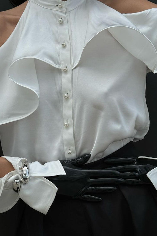 Elegant French Design Halter Top featuring a ruffled blouse and stylish black pants fashion