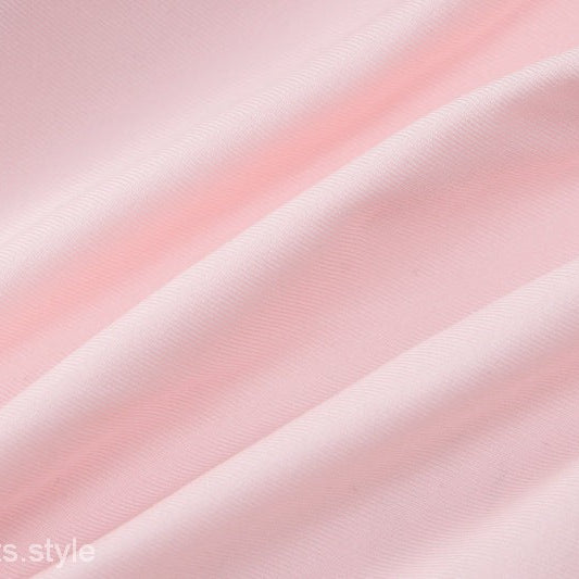 Wrinkled pink fabric of HALTER LOW CUT RUFFLED DRESS showcasing sexy halter low design