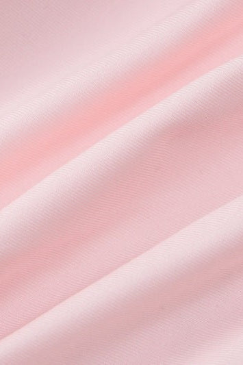 Wrinkled pink fabric of HALTER LOW CUT RUFFLED DRESS showcasing sexy halter low design