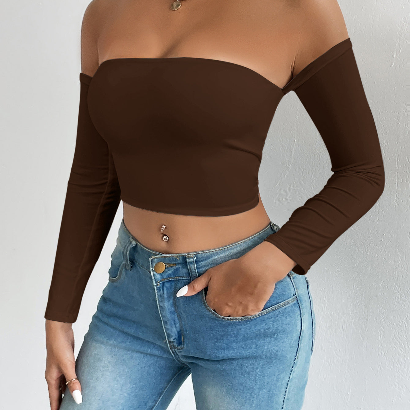 Elegant dark brown off-the-shoulder crop top showcasing fashionable ملابس for stylish women