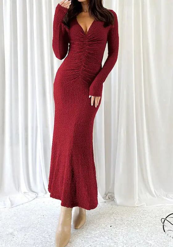 Beautiful knitted burgundy long-sleeved ruched dress