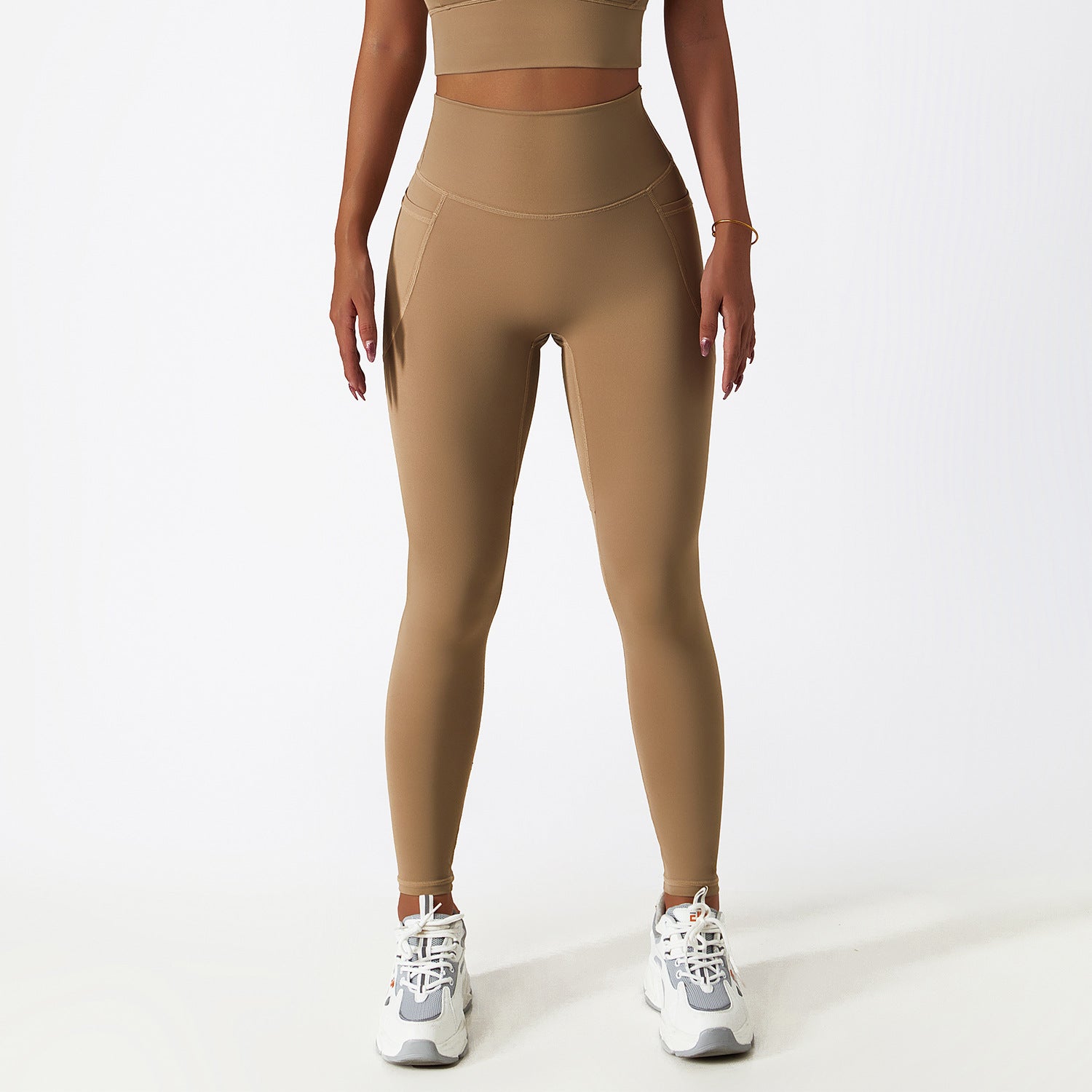 High-waisted tan athletic leggings paired with white sneakers from Breathable Cloud Feeling ملابس