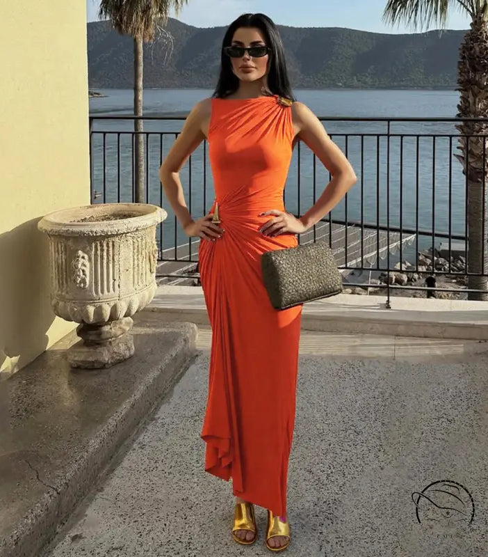 Elegant langry fashion orange sleeveless maxi dress with gold heels and clutch