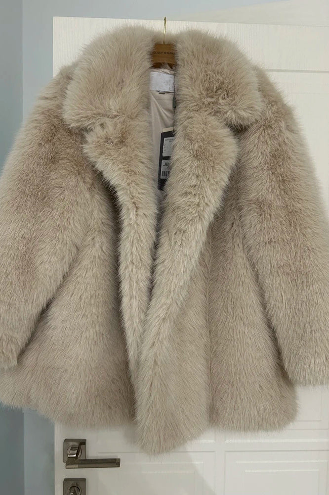 Cream faux fur coat with high collar and long sleeves