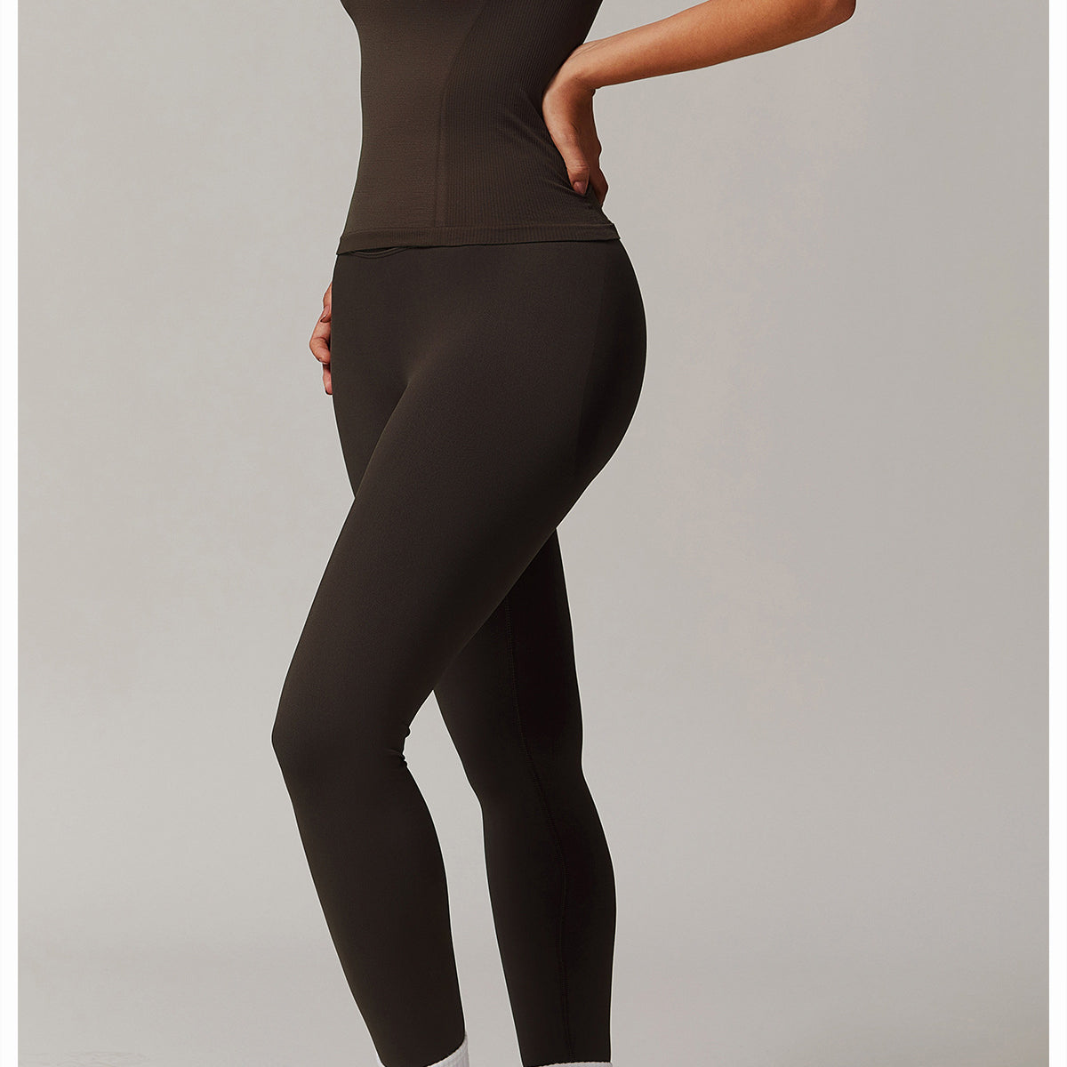 Form-fitting brown top and leggings for stylish yoga and activewear fashion