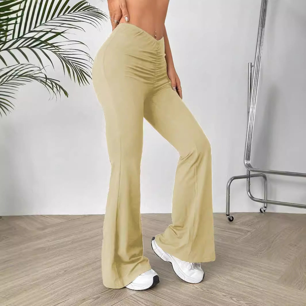 Khaki ruched flare leggings with V-cut waist showcasing shaped waist slimming and slimming bootcut style