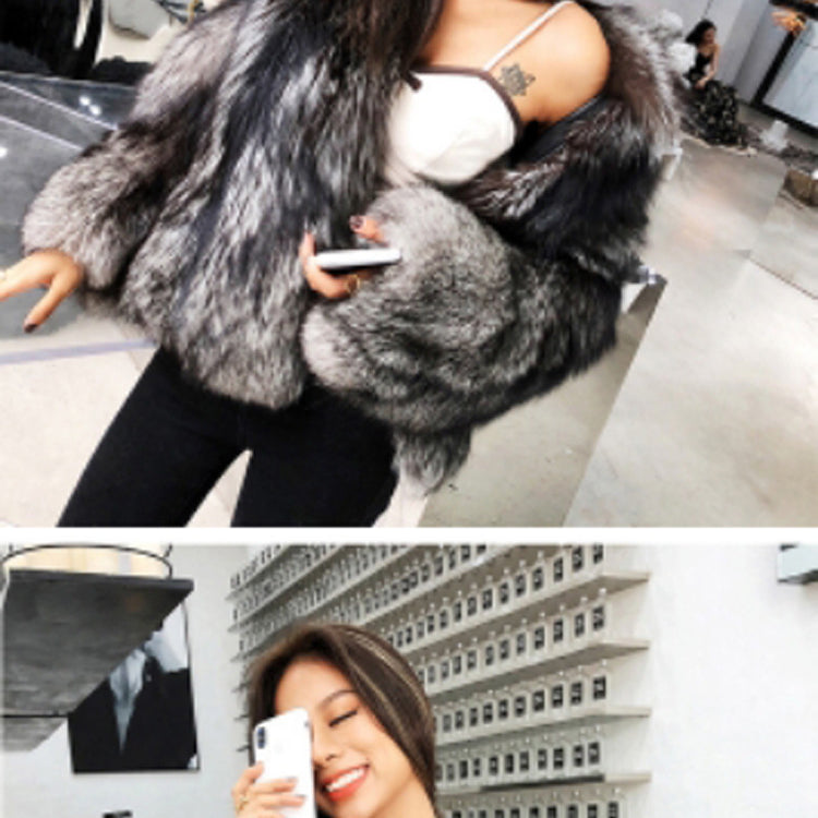 Luxurious grey faux fur coat displayed in a stylish salon setting for fashion enthusiasts
