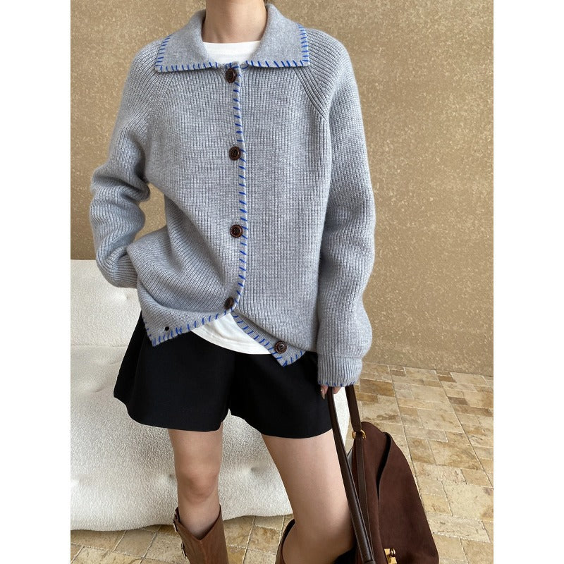 Gray knit cardigan sweater with button closure, contrast trim, and regular sleeve fashion