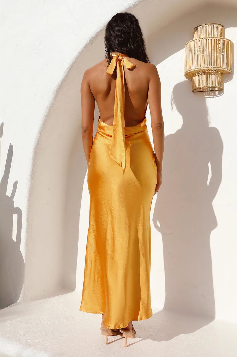 Mustard yellow satin dress with halter neck and tie-up back