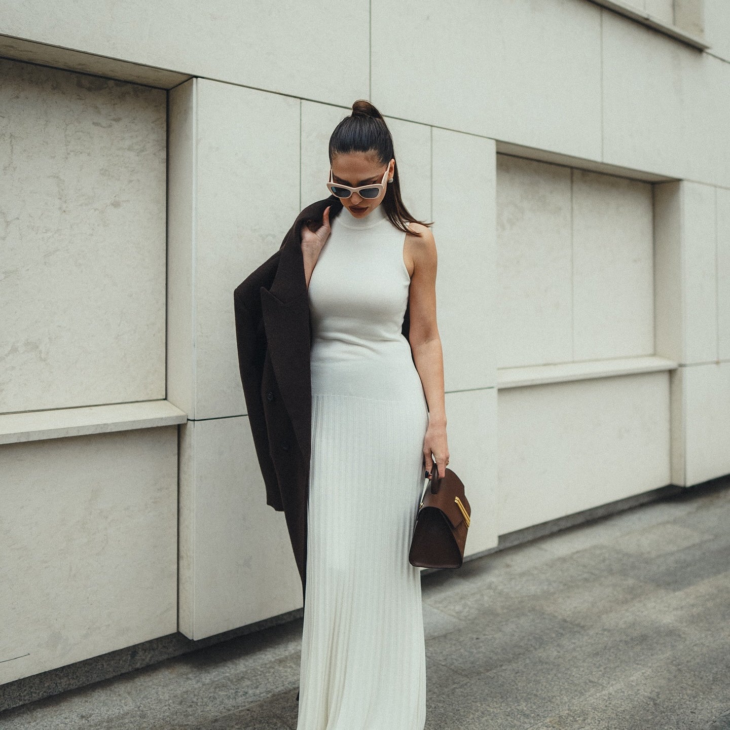 Sleek white floor-length Enchanting Knitted Maxi Dress showcasing a fitted silhouette in fashion
