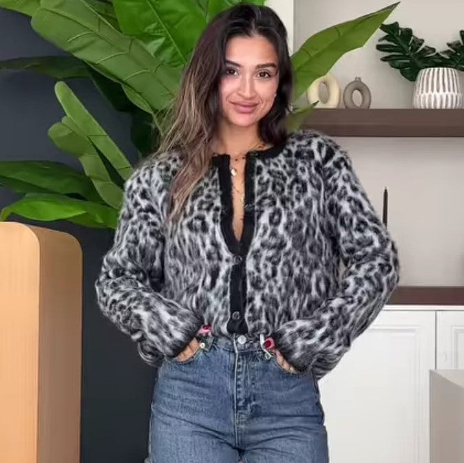Woman in a gray and black leopard print cardigan with regular sleeves for stylish fashion
