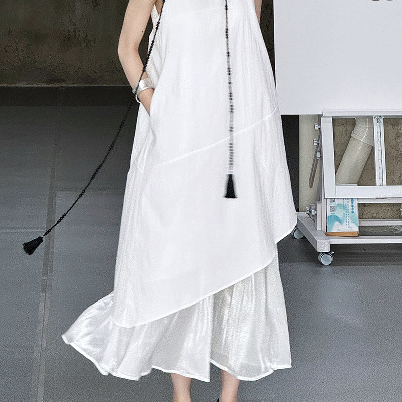 White layered cotton sundress with ruffled hem, embodying elegant Korean style