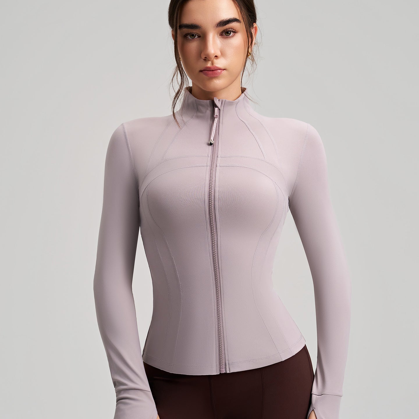 Long sleeve lavender zip-up yoga jacket with ribbed cuffs and stretchy fabric