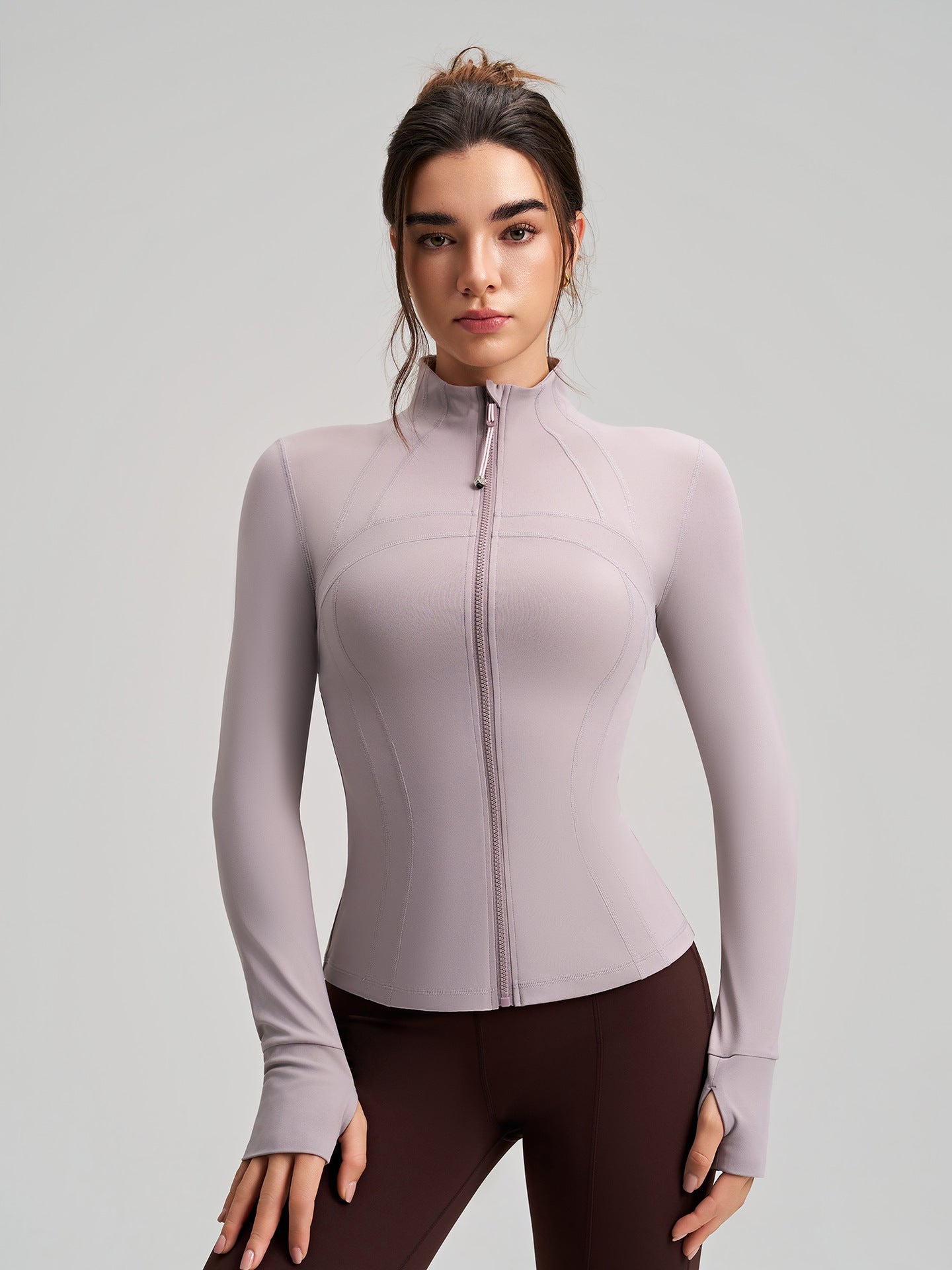 Long sleeve lavender zip-up yoga jacket with ribbed cuffs and stretchy fabric