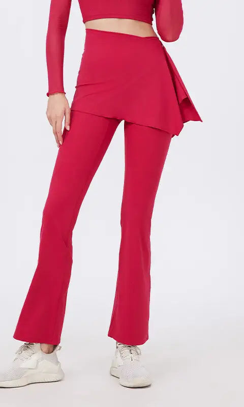Red flared yoga pants with hip lifting peplum hem and nude feel fabric paired with white sneakers