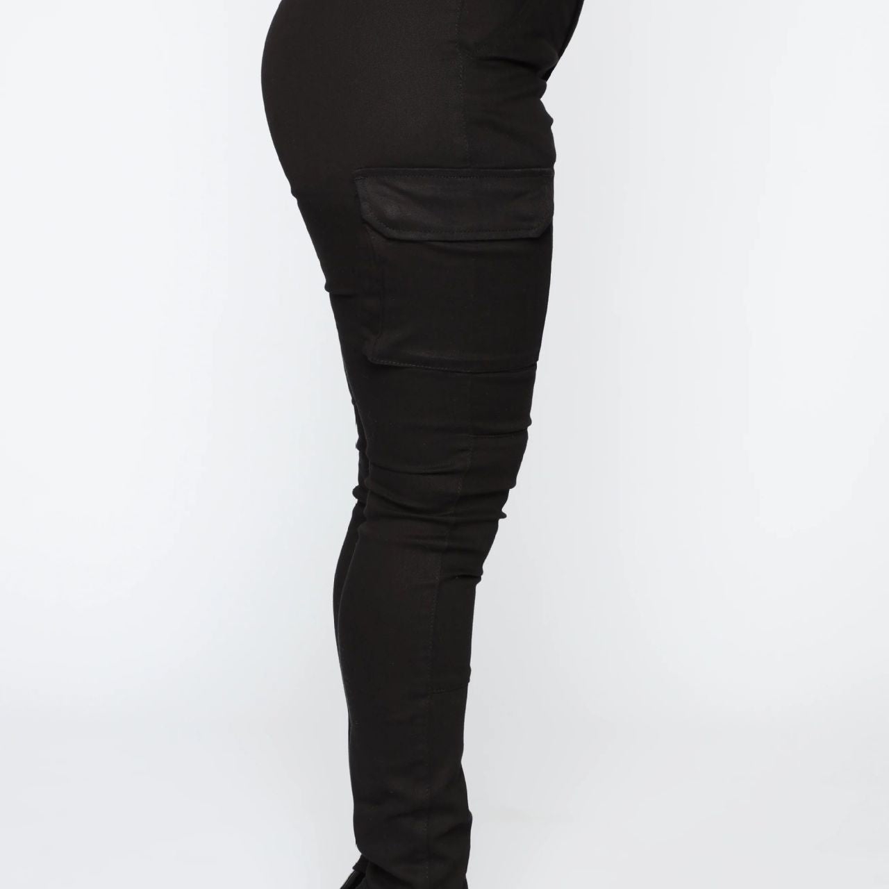 Black belted cargo pants with stiletto heels showcasing casual skinny stretch and stretch belt sports style