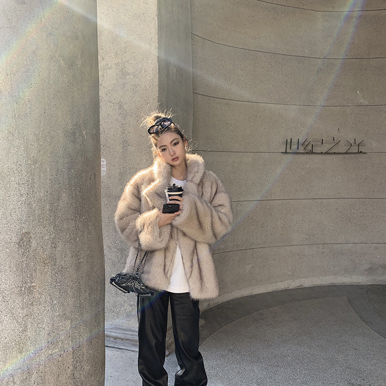 Langry faux fur winter jacket with black pants and roller skates