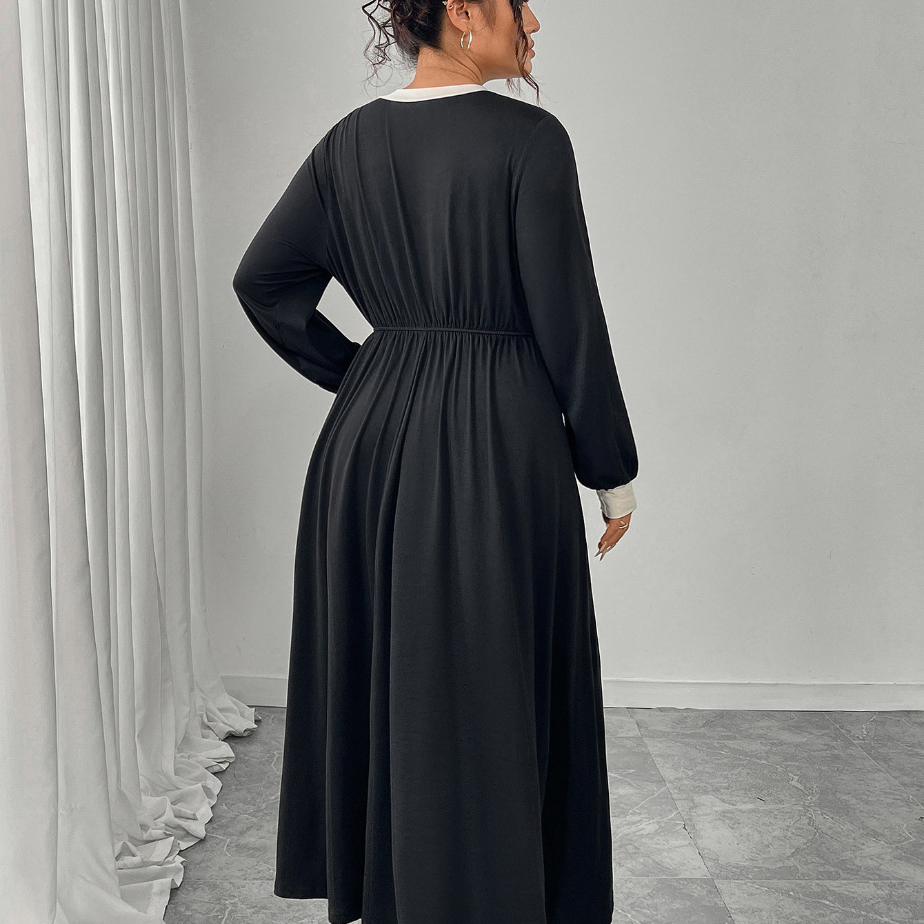 Plus size black maxi dress with white trim and pleated skirt by Langry fashion