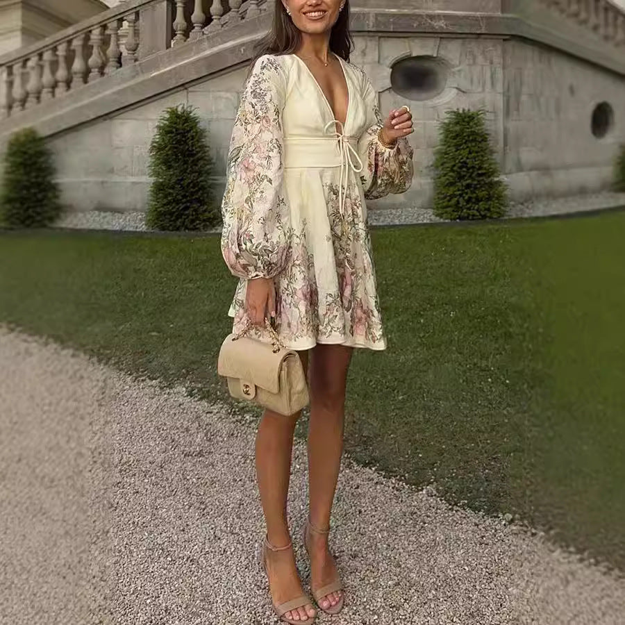 Elegant lantern sleeve floral mini dress with deep V-neck and trendy lace-up detail