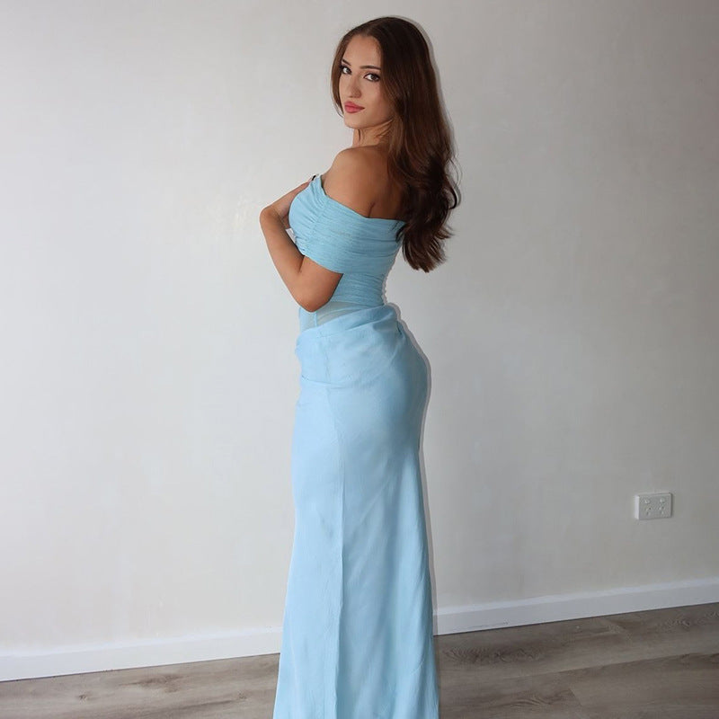 Light blue off-shoulder maxi dress showcasing elegance and contemporary fashion style