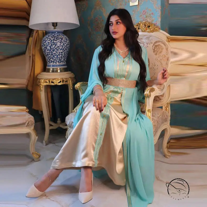 Light blue and gold silk kaftan dress with embroidery, white pants, beige heels